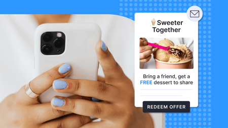 A person with nail polish on a phone and screenshot of a free offer on the side